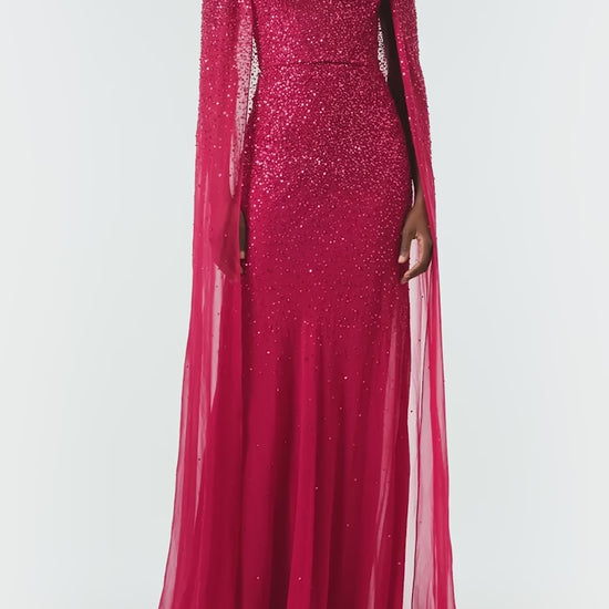 Monique Lhuillier Fall 2024 Scoop neck, floor length gown with integral cape in Merlot embroidered chiffon - video.