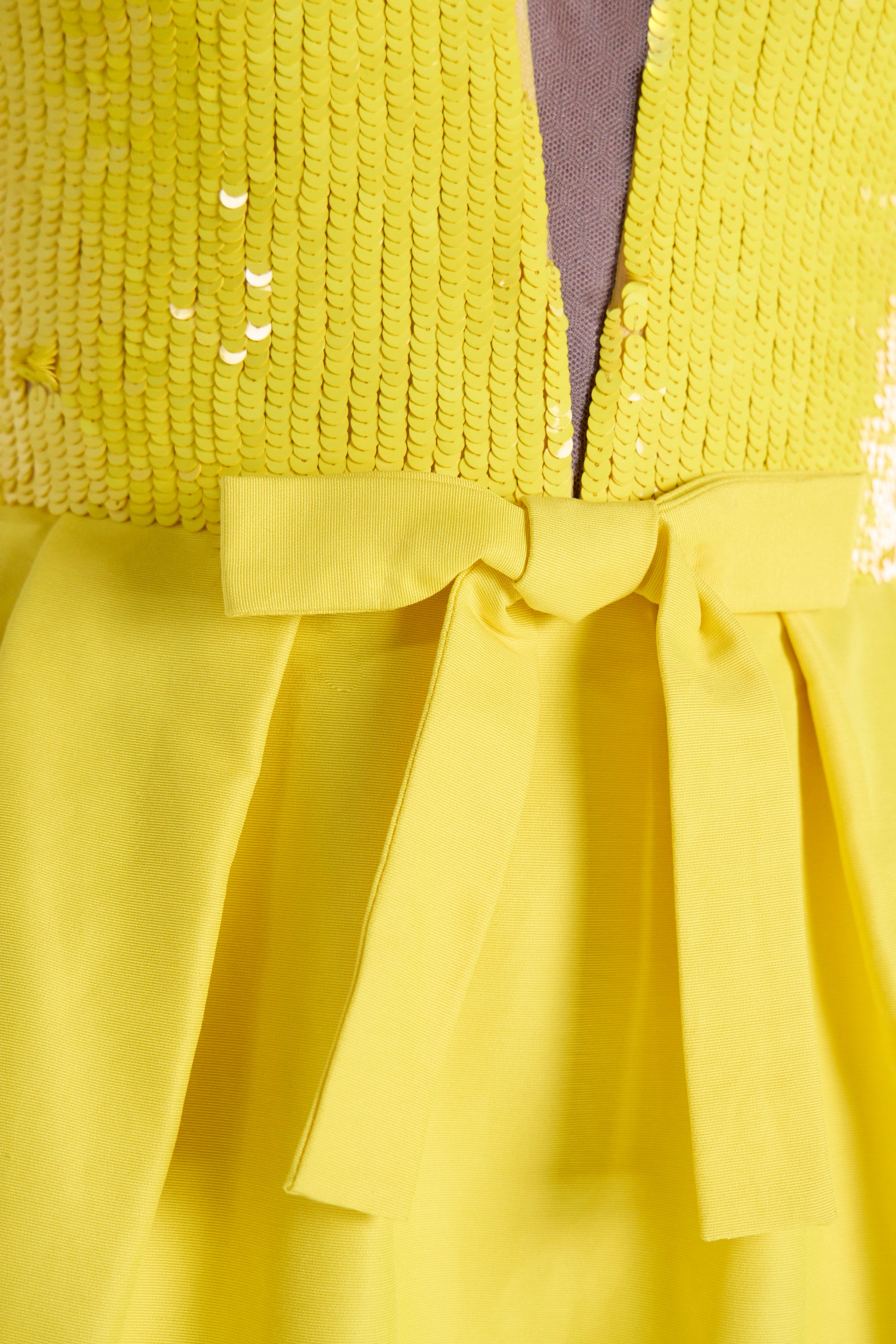 Yellow silk faille floor length gown with sequin bodice and illusion neckline.